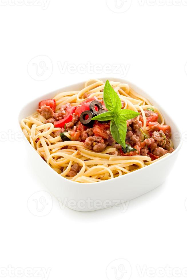 Pasta with italian sausage meat sauce on white background photo