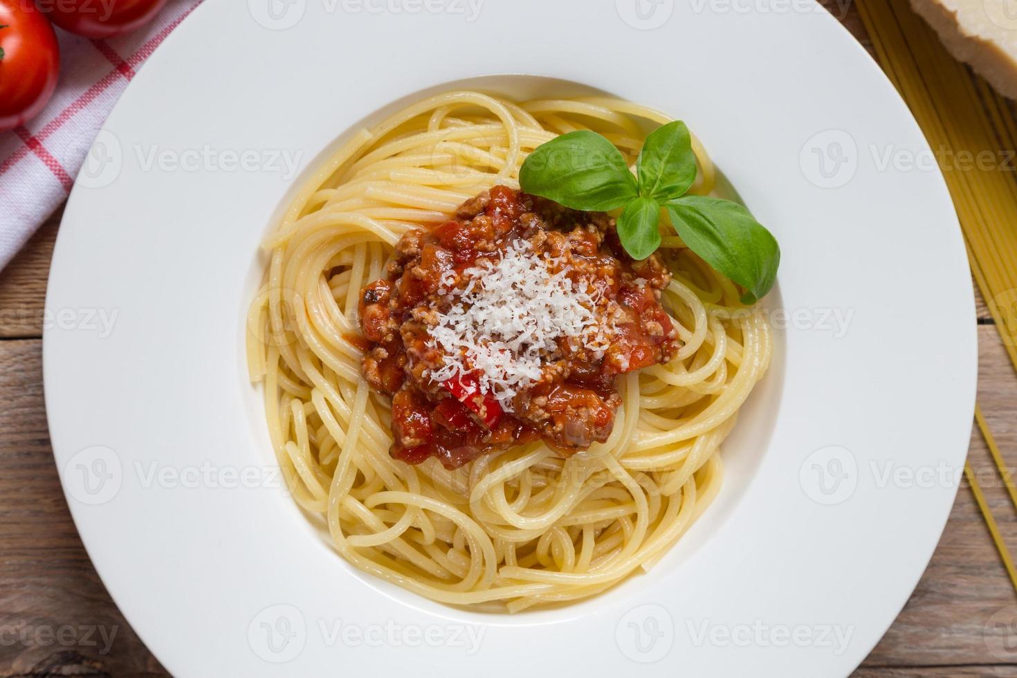 Spaghetti with Bolognese Sauce Parmesan and basil photo