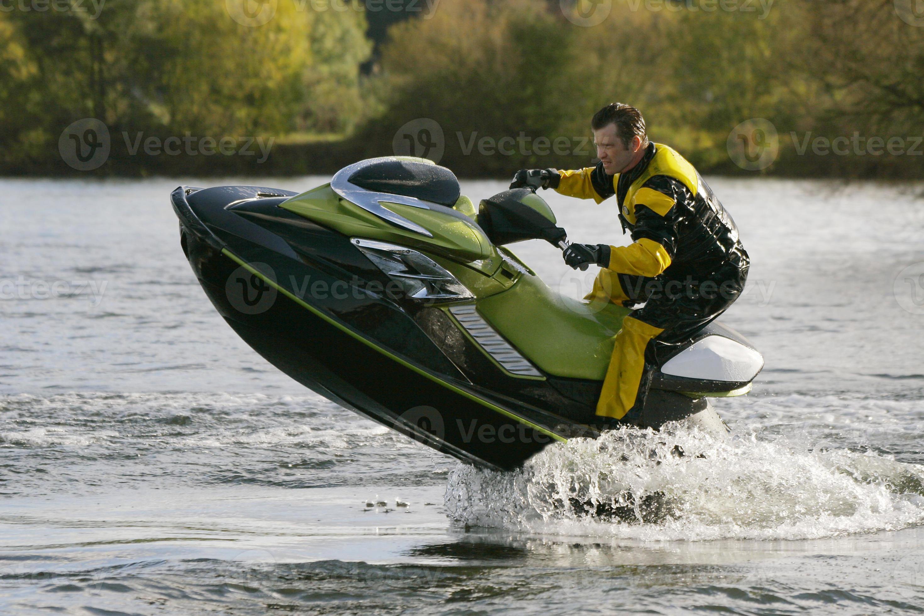 Jet Ski Wet Bike Leaping Out Of The Water 734323 Stock Photo at Vecteezy