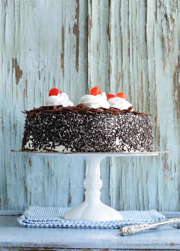 Chocolate cake with cherries photo