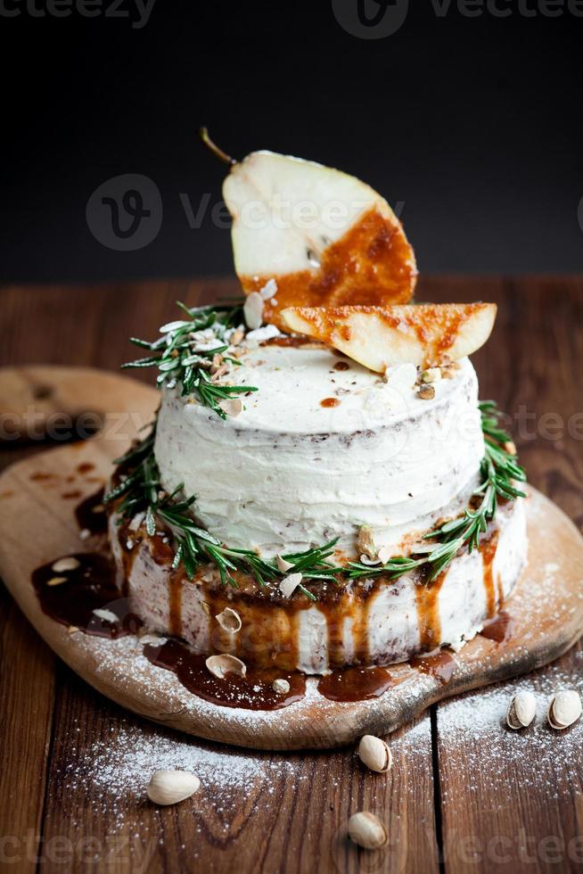 Cream cake with caramel and decoration photo