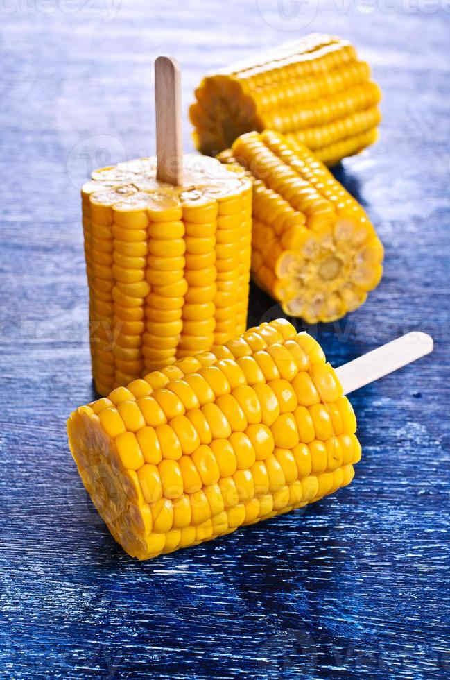 Cut corn on the cob on a stick 739542 Stock Photo at Vecteezy