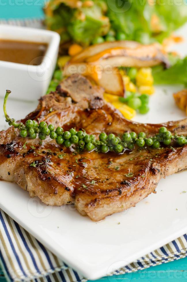 grilled t-bone steak and vegetables photo