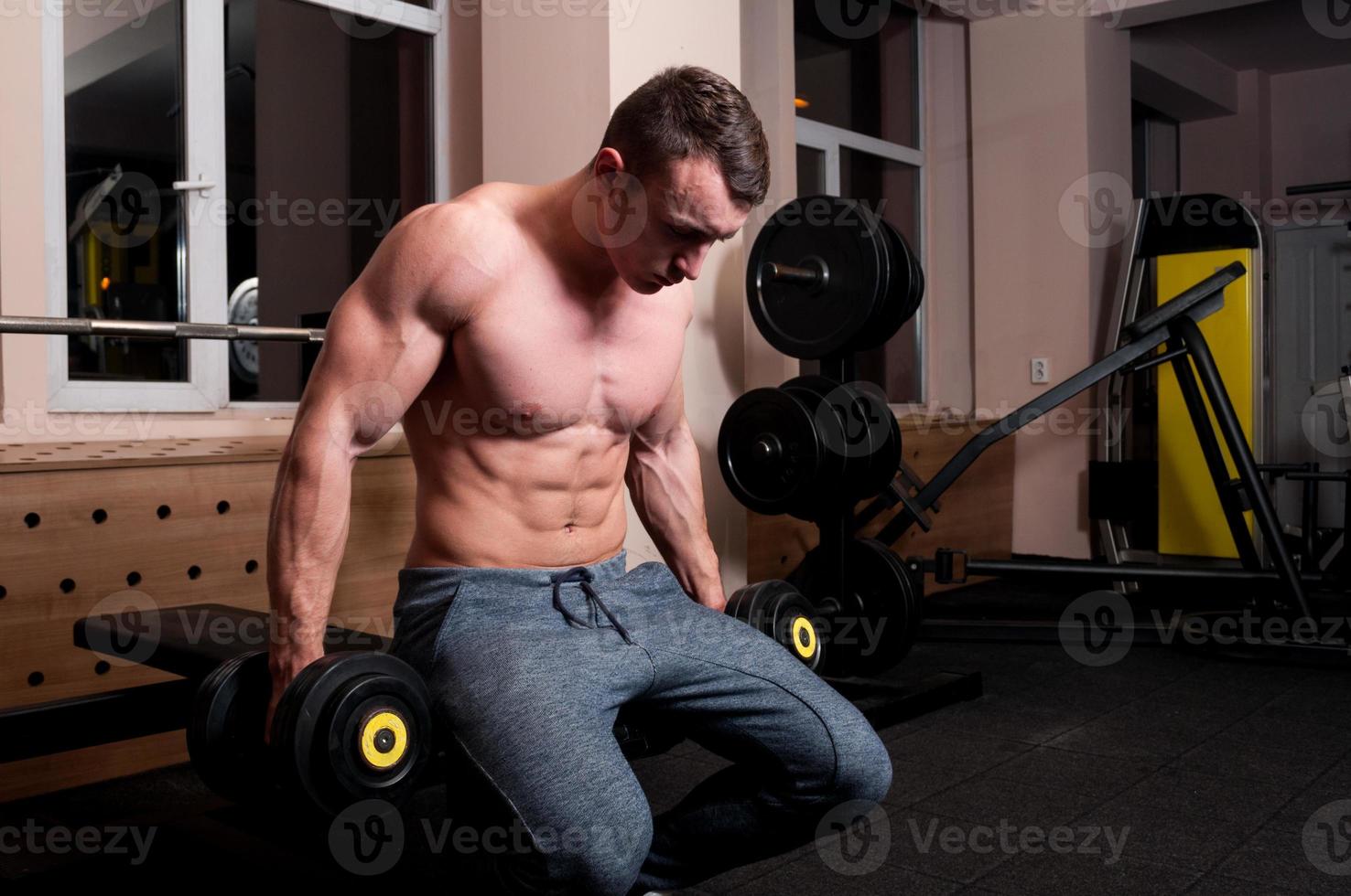 Concentrated body builder ready to lift photo