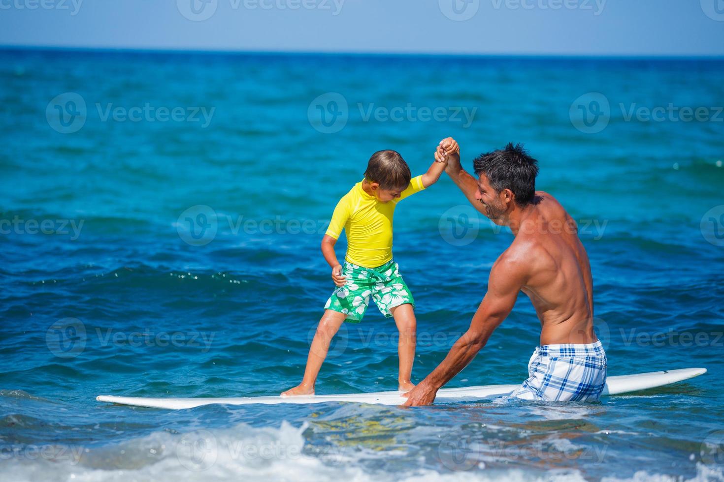 Boy surfing photo