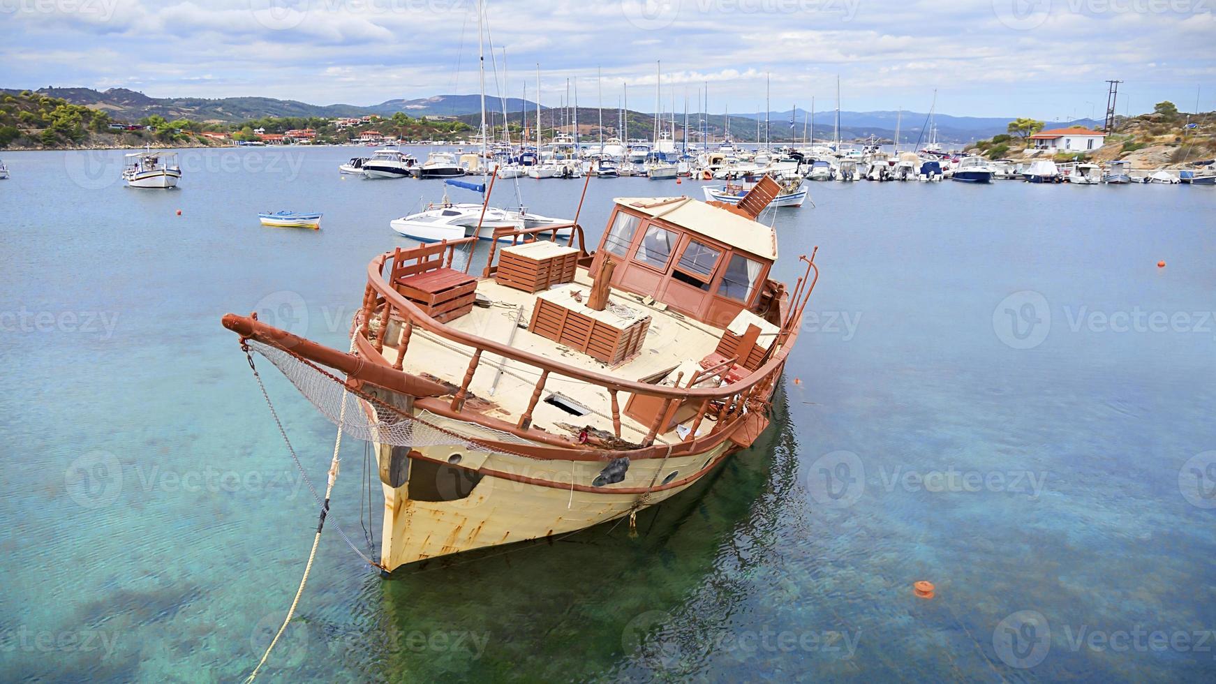 Aerial view of a wooden boat in the sea photo