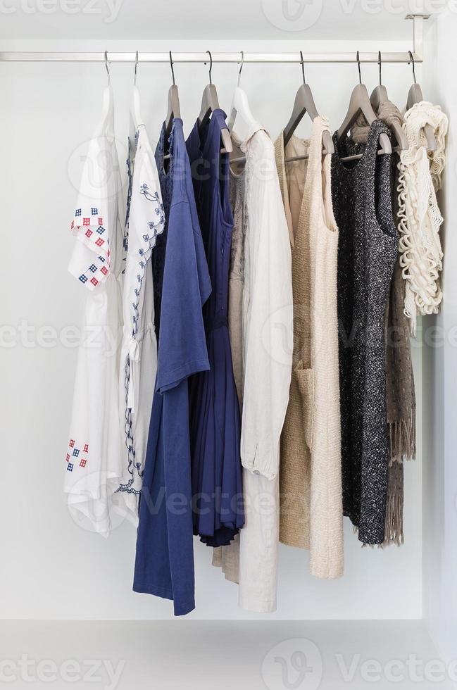 row of cloth hanging on coat hanger photo