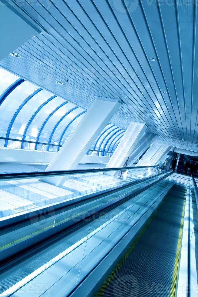 moving escalator in airport photo
