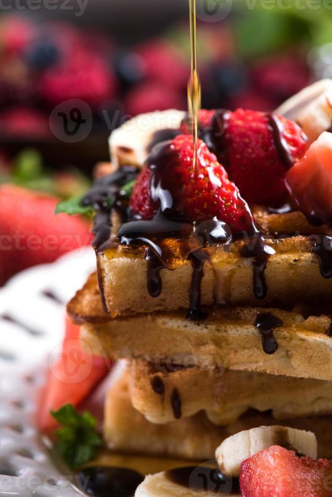 sweet waffles with fruits and chocolate photo