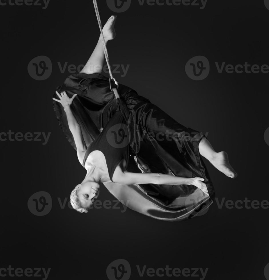 Young woman gymnast on rope photo