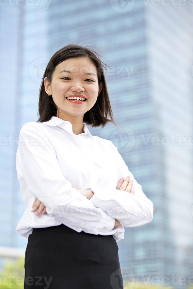 Young Asian female executive portrait at business district photo