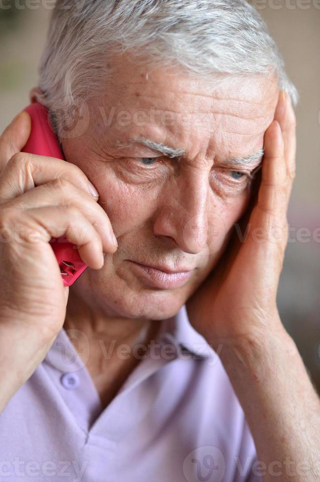 elderly man calling to the doctor photo
