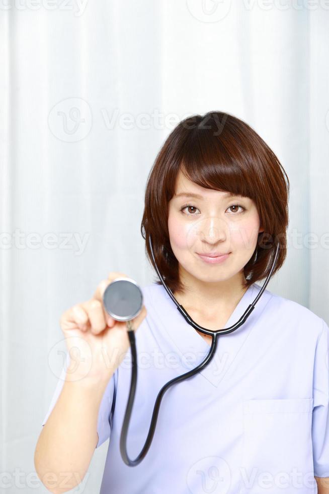 Japanese Female Doctor With Stethoscope photo