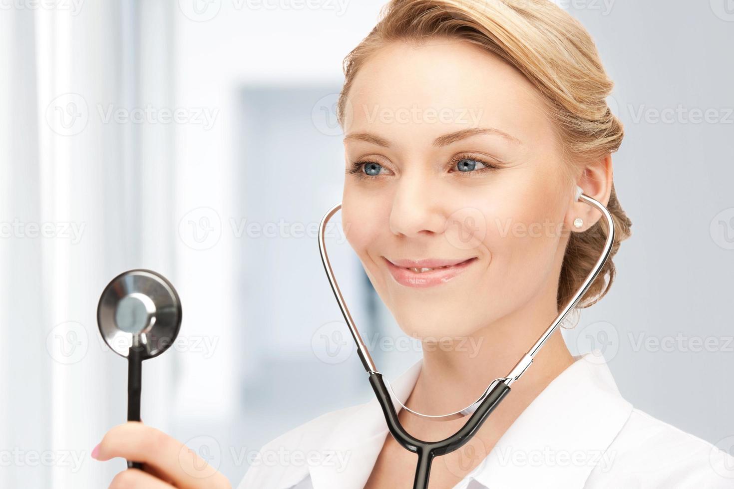 attractive female doctor with stethoscope photo