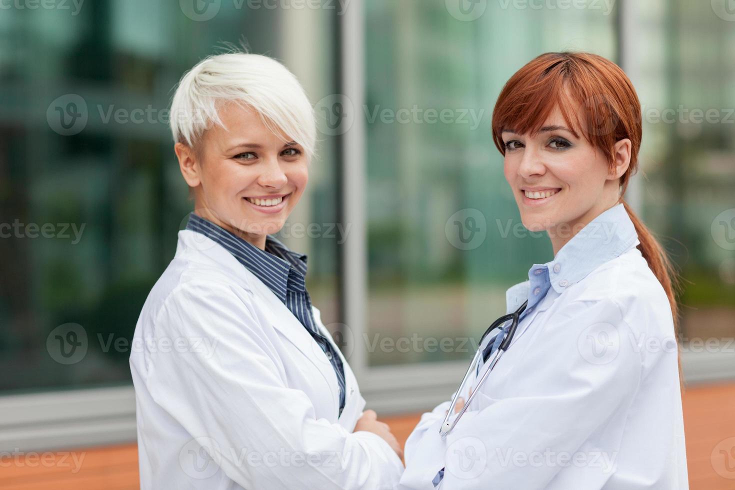 Portrait of two female doctors photo