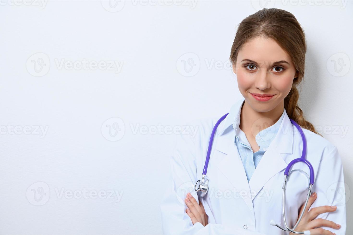 Friendly smiling young female doctor photo