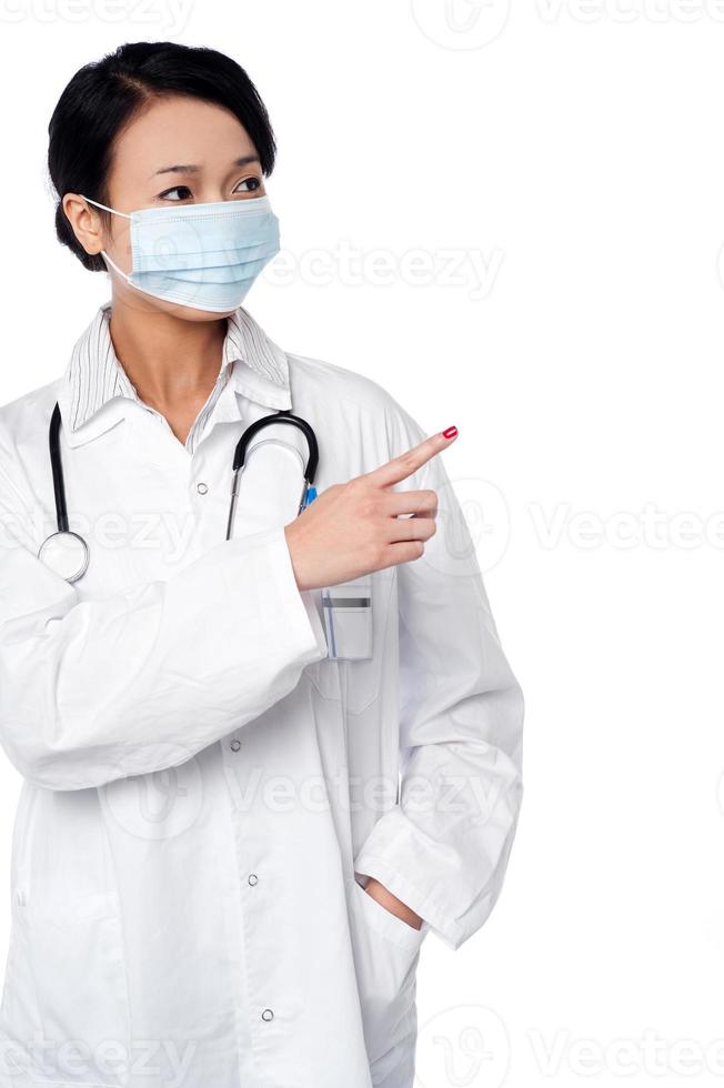 Female surgeon pointing out something photo