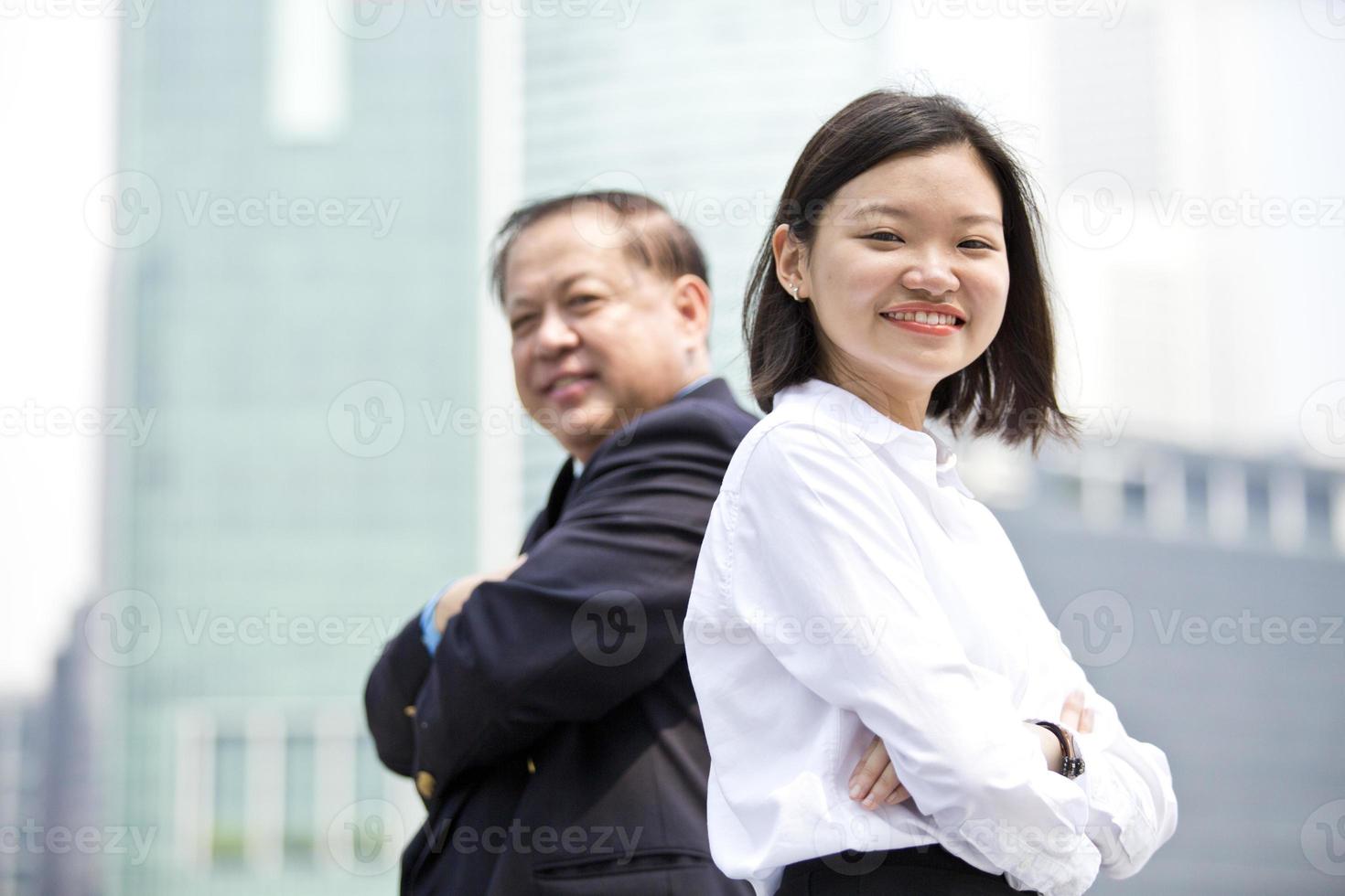 Asian businessman and young female portrait photo