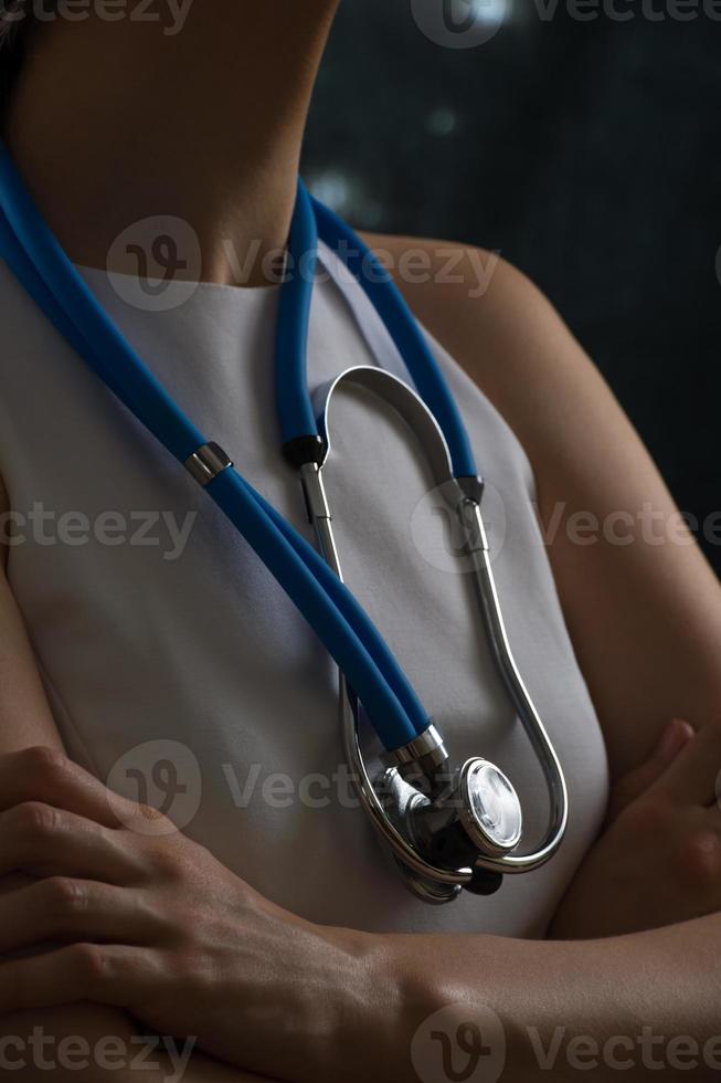 Futuristic modern unrecognizable female doctor with stethoscope photo