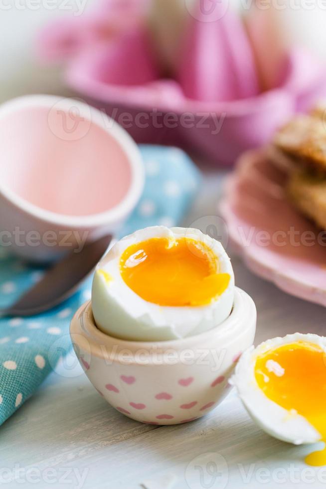 Opened boiled blue duck egg with soft yolk photo