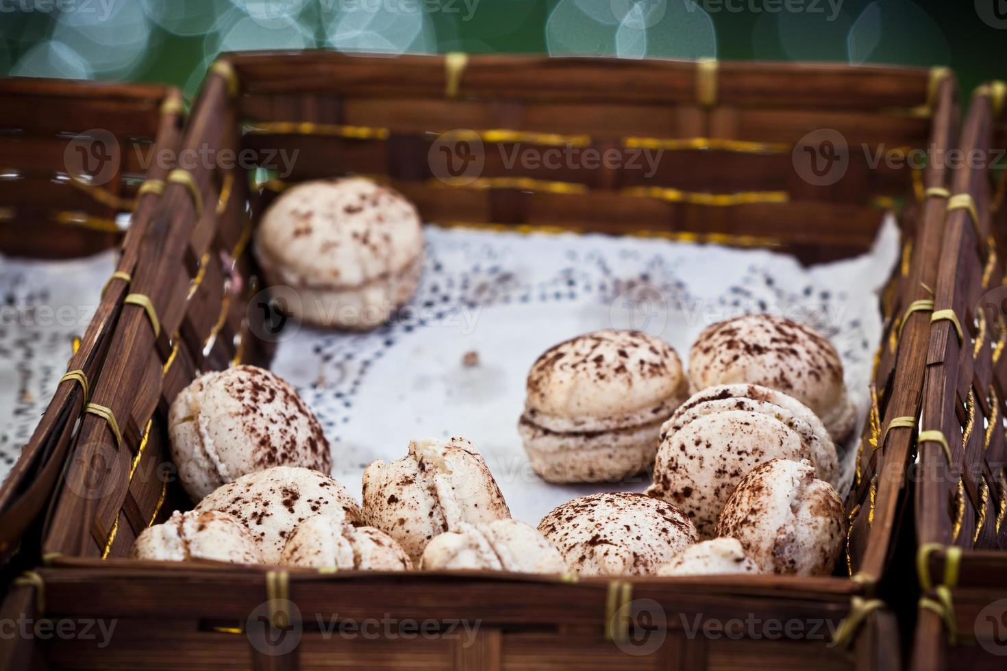 Macarons assortment in a wickered box photo