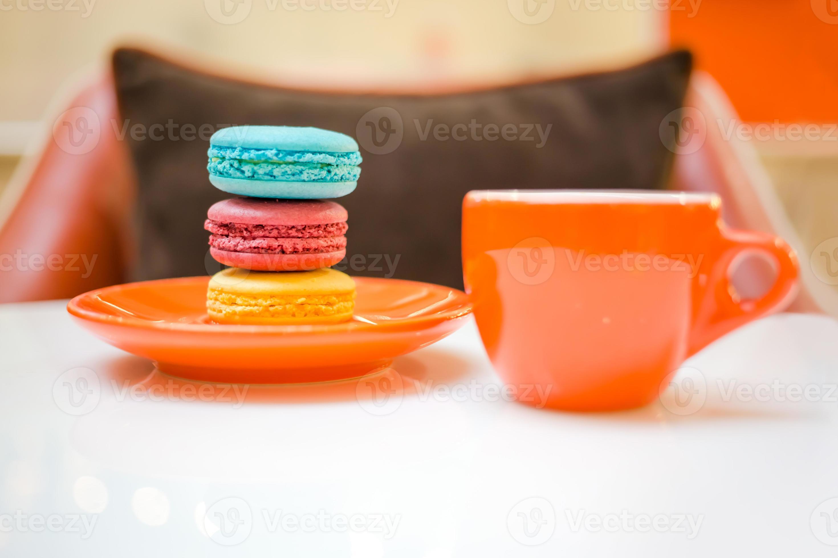 Colorful macarons with coffee photo