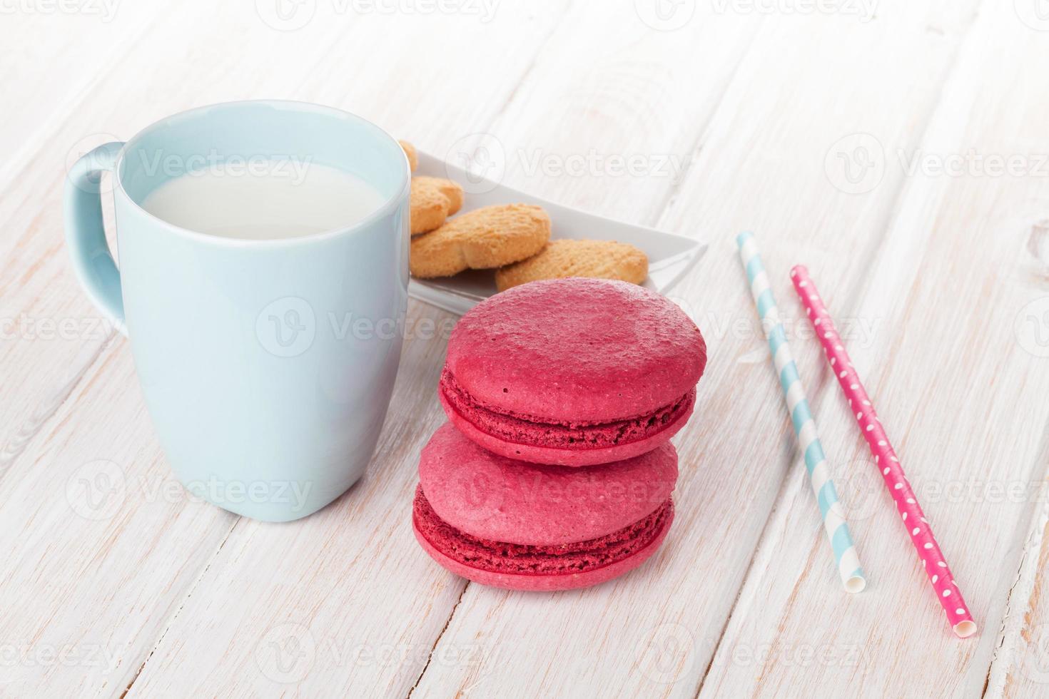 Cup of milk and macarons photo