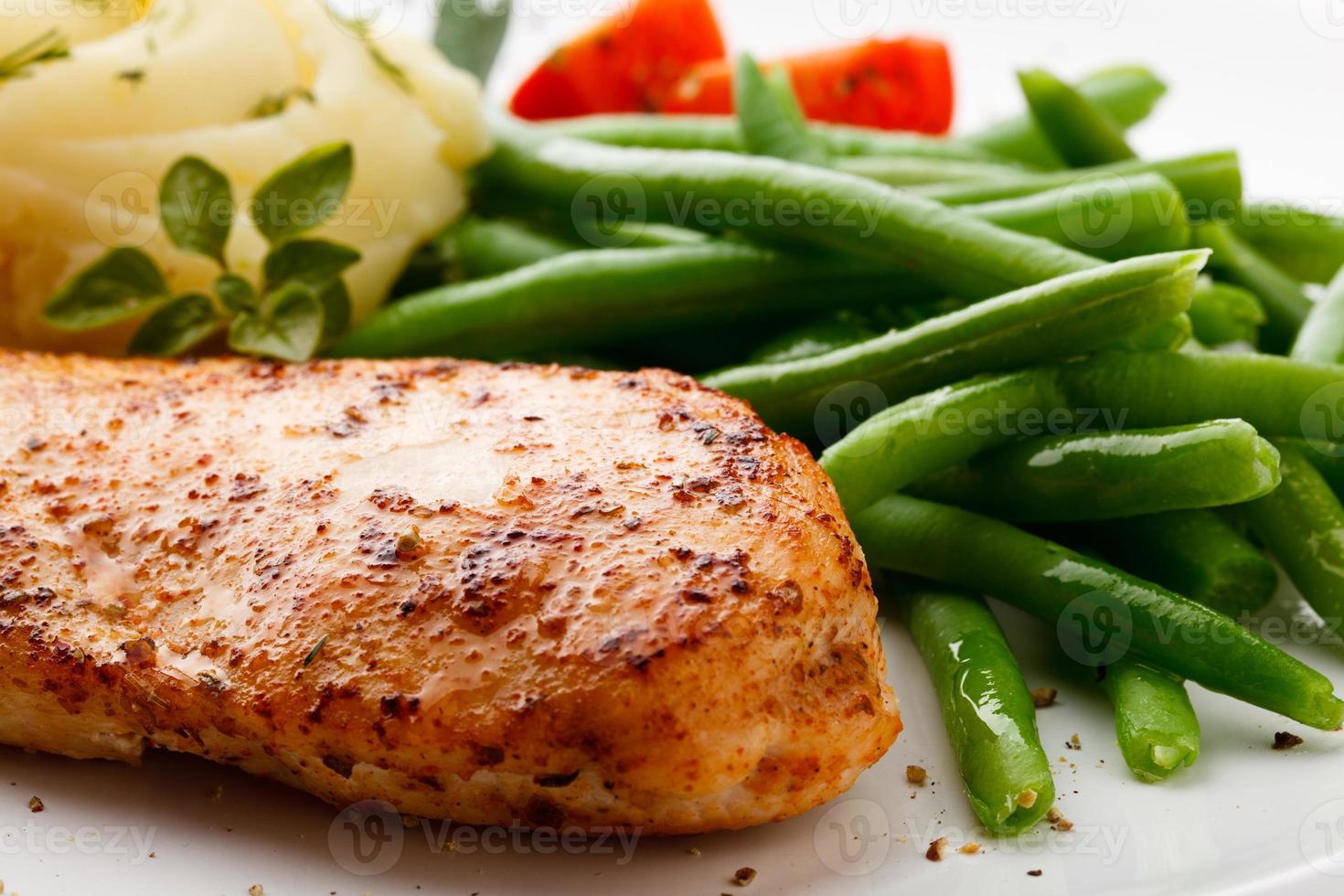 Grilled chicken fillet and vegetables photo