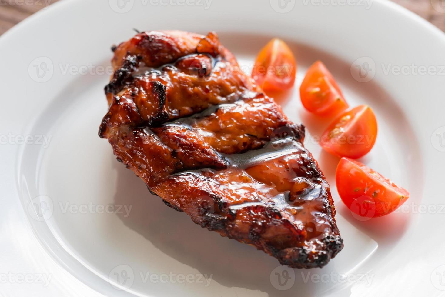 Grilled chicken steak with cherry tomatoes photo