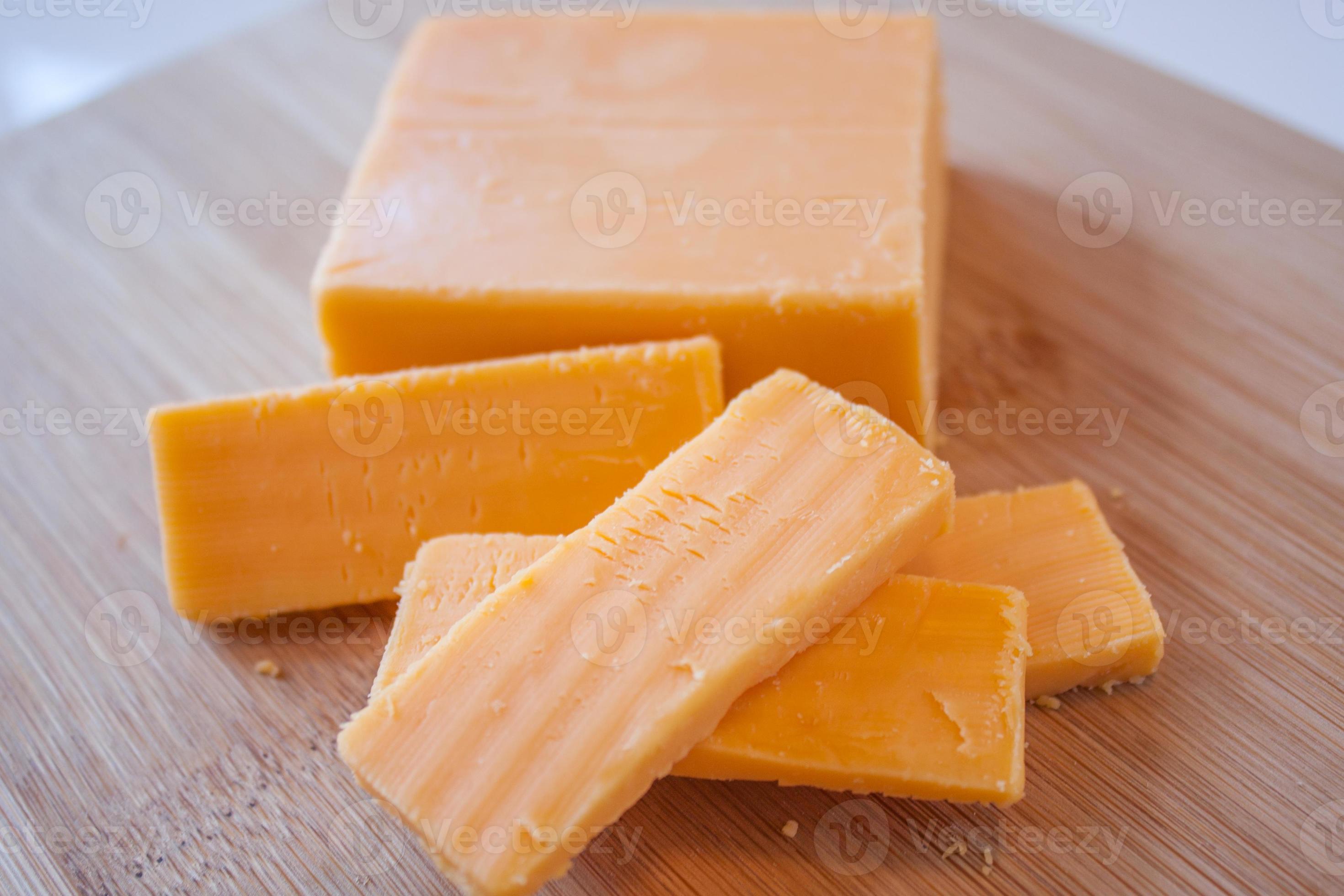 Cheddar Cheese Block and Slices 761011 Stock Photo at Vecteezy
