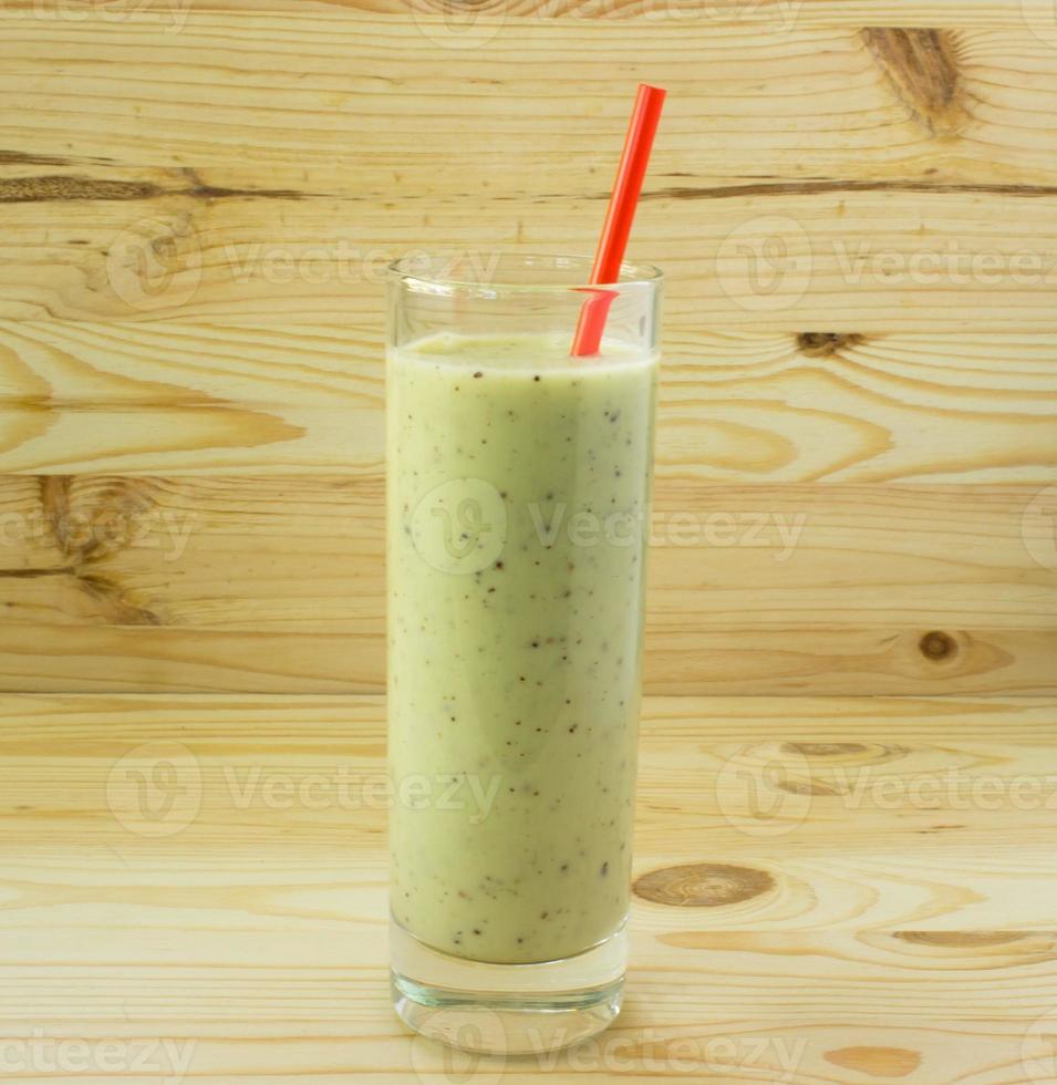 Smoothie with kiwi and red straw photo