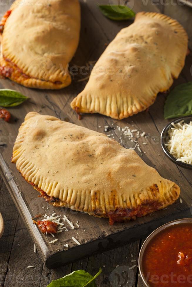 Homemade Italian Meat and Cheese Calzones 764117 Stock Photo at Vecteezy