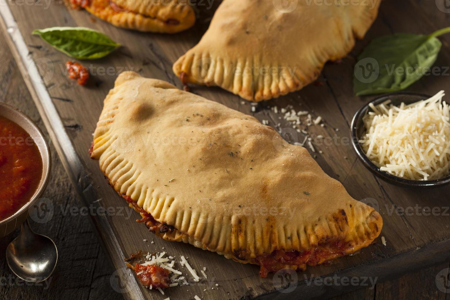 Homemade Italian Meat and Cheese Calzones 764121 Stock Photo at Vecteezy