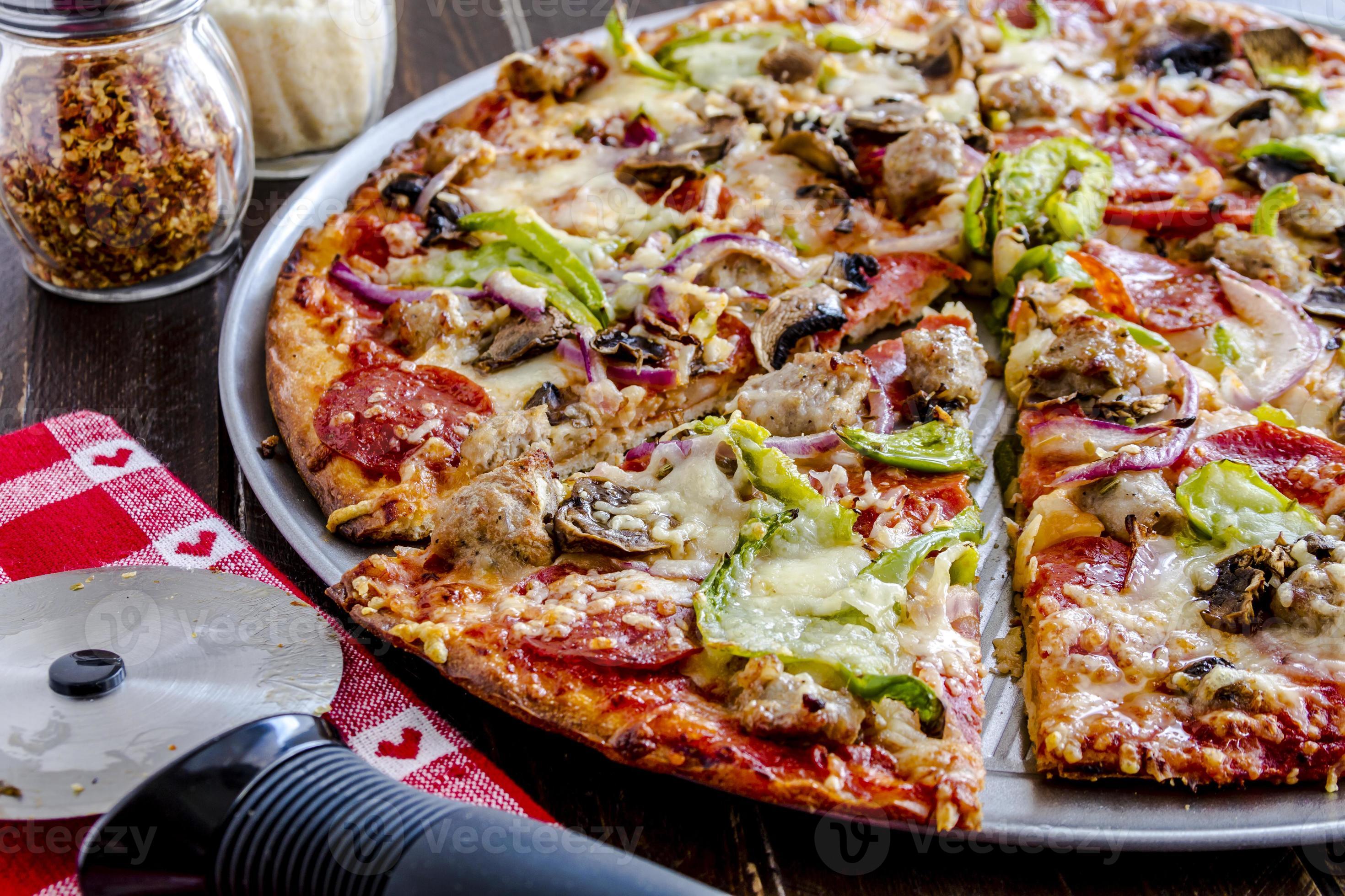 Fresh Thin Crust Supreme Pizza 764271 Stock Photo at Vecteezy