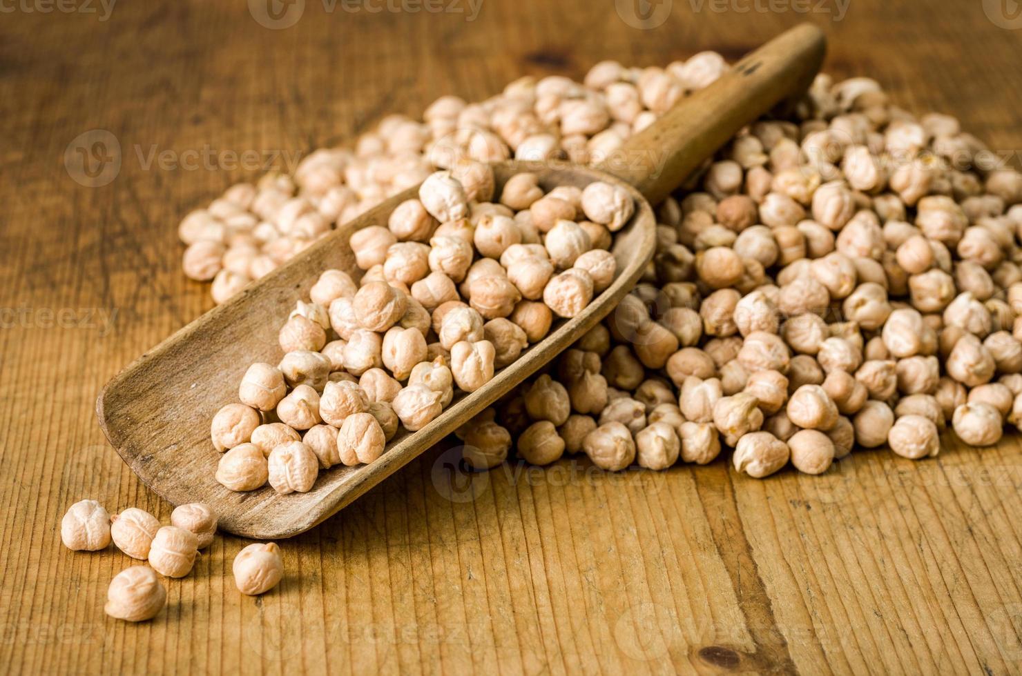 Wooden scoop with chickpeas photo