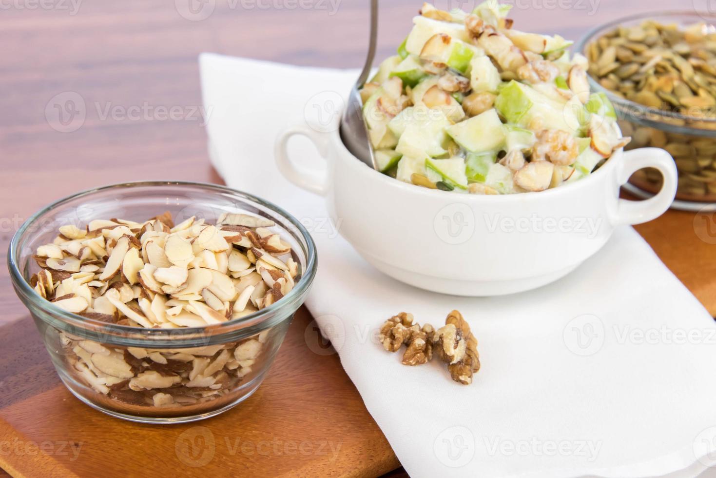 apple salad with almonds, walnuts and pumpkin seeds photo