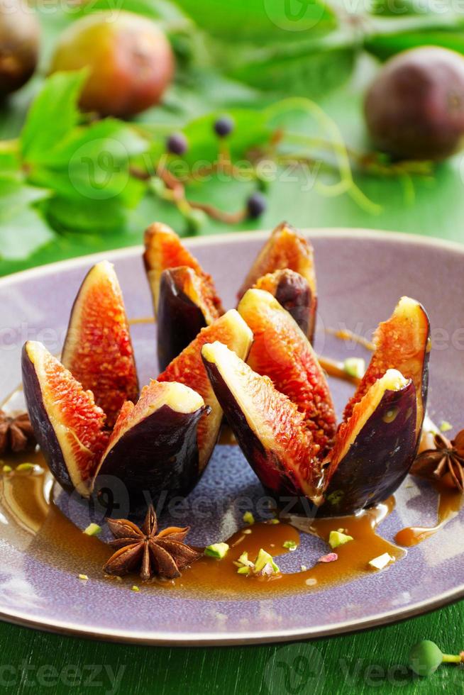 Baked figs with caramel and spices. photo