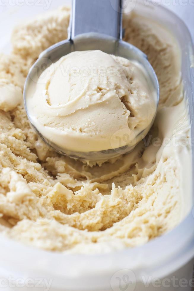 Homemade creamy ice cream in metal  scoop. Selective focus photo