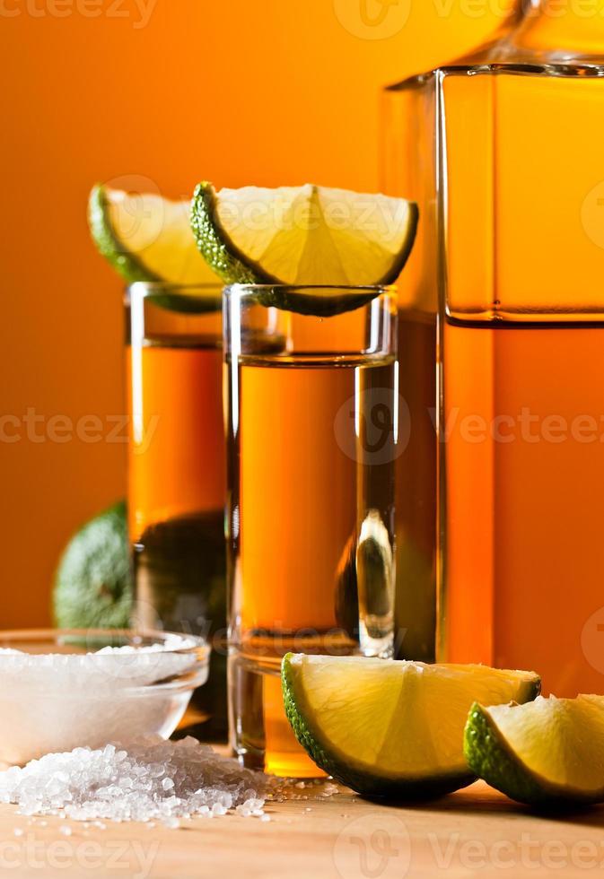 gold tequila with salt and lime photo