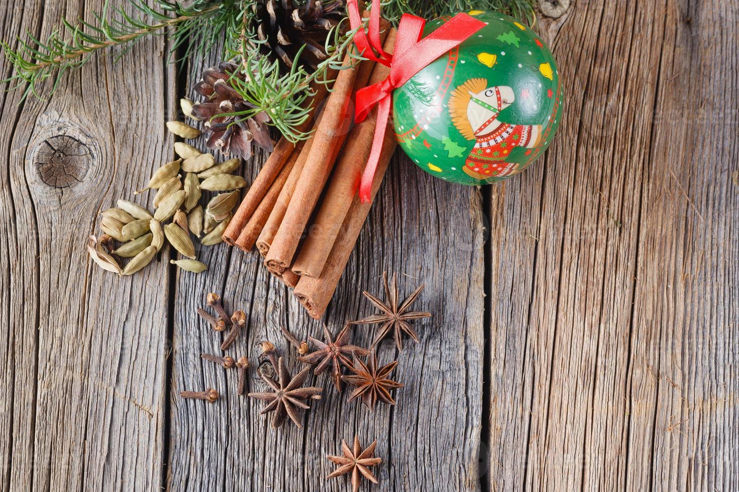 Mulled wine recipe, spices on wooden background photo