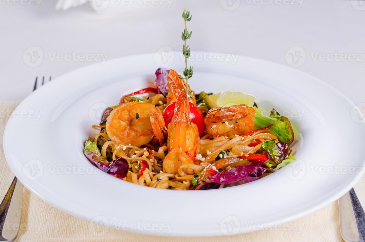 Speciality pasta recipe with prawns and vegetables photo