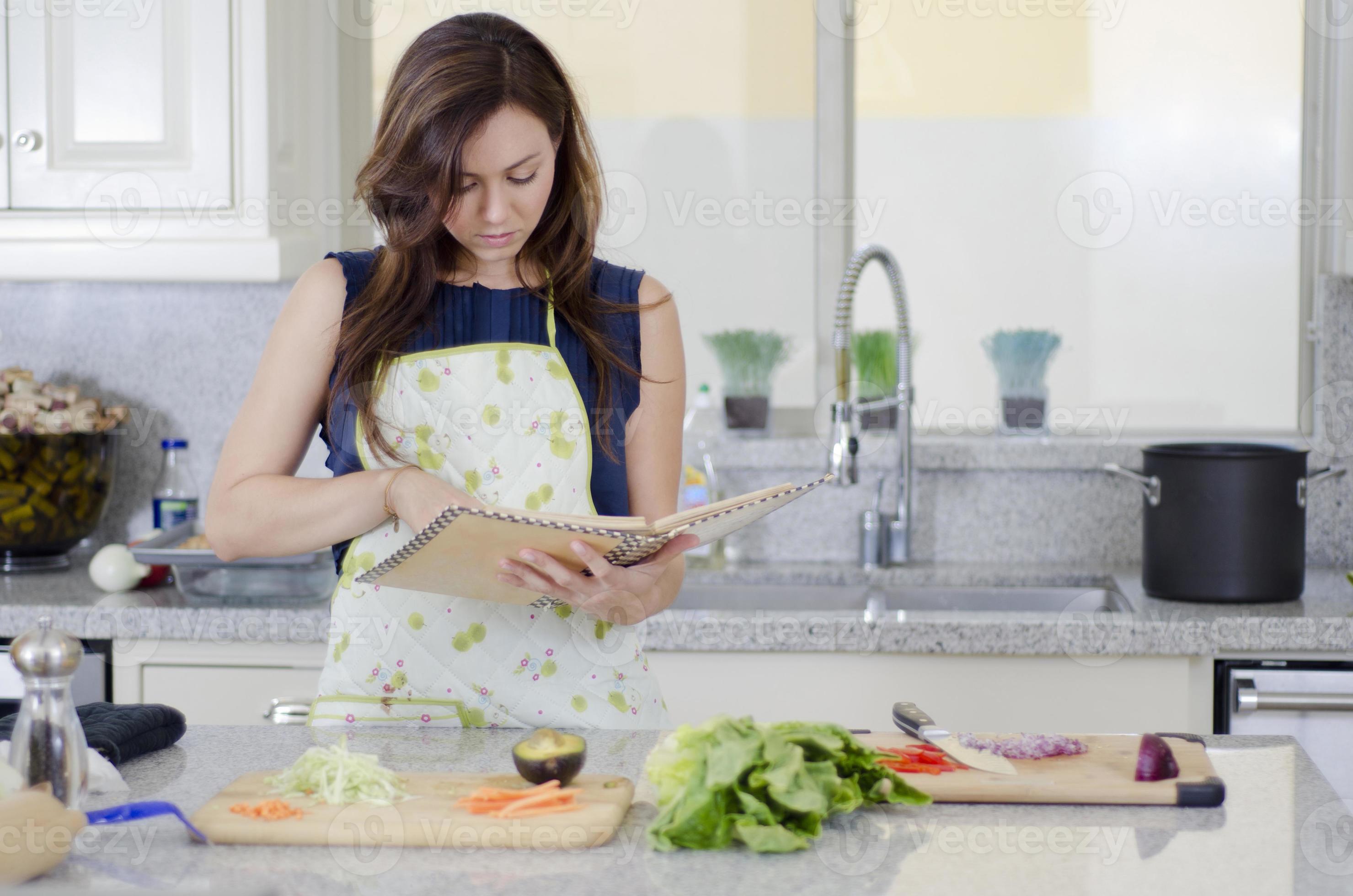 Beautiful housewife cooking a recipe picture