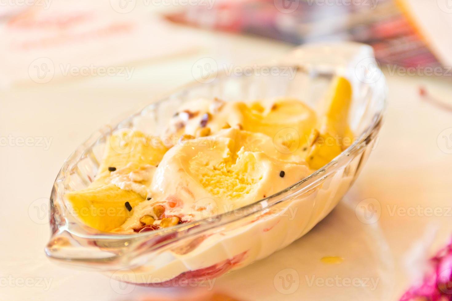 Vanilla ice cream with banana and chocolate sauce photo