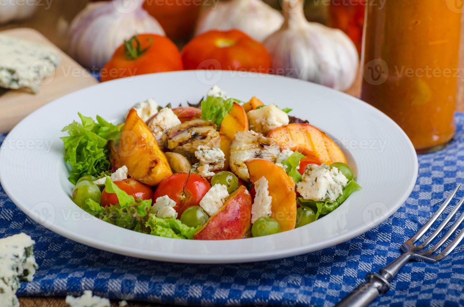 Grilled fruit with blue cheese and salad photo