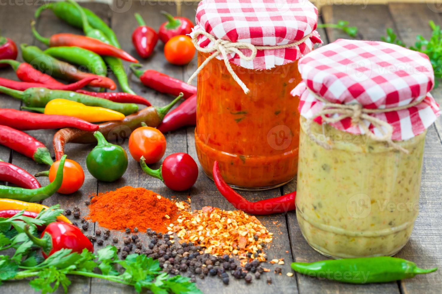 Salsa with hot chili peppers photo