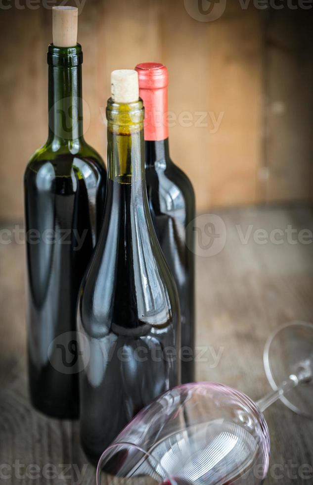 Bottles with red wine photo
