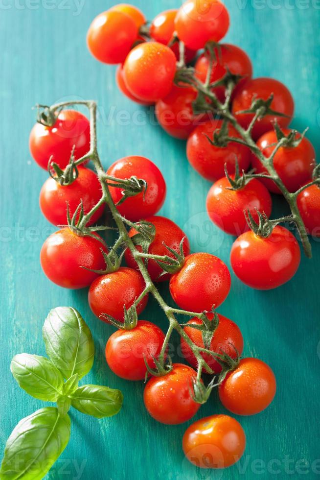 cherry tomatoes over turquoise background photo