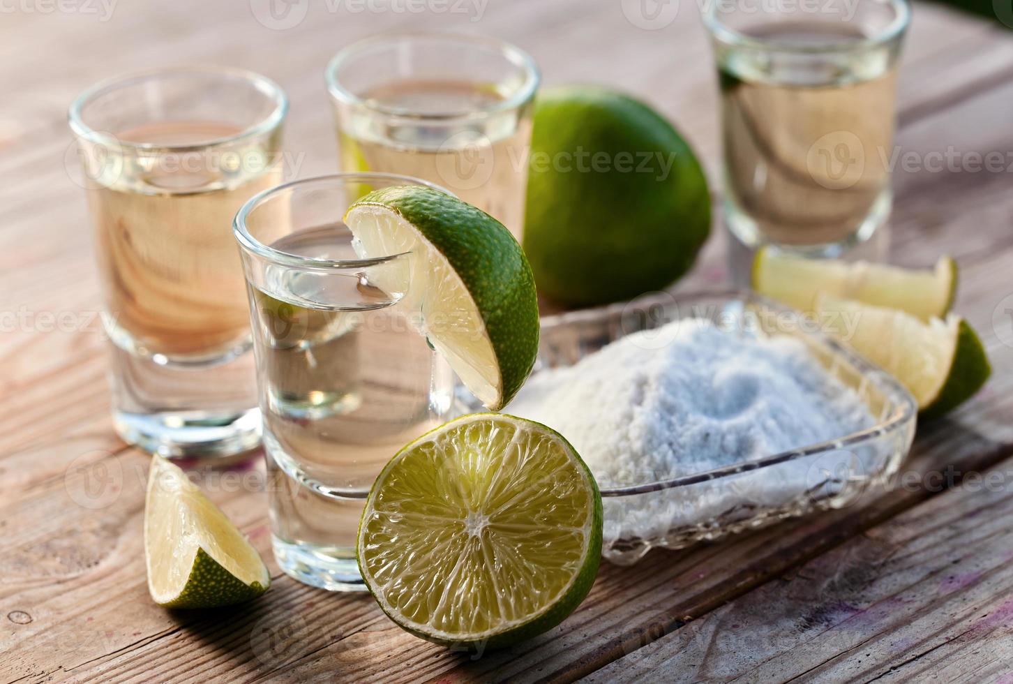 gold tequila with salt and lime photo