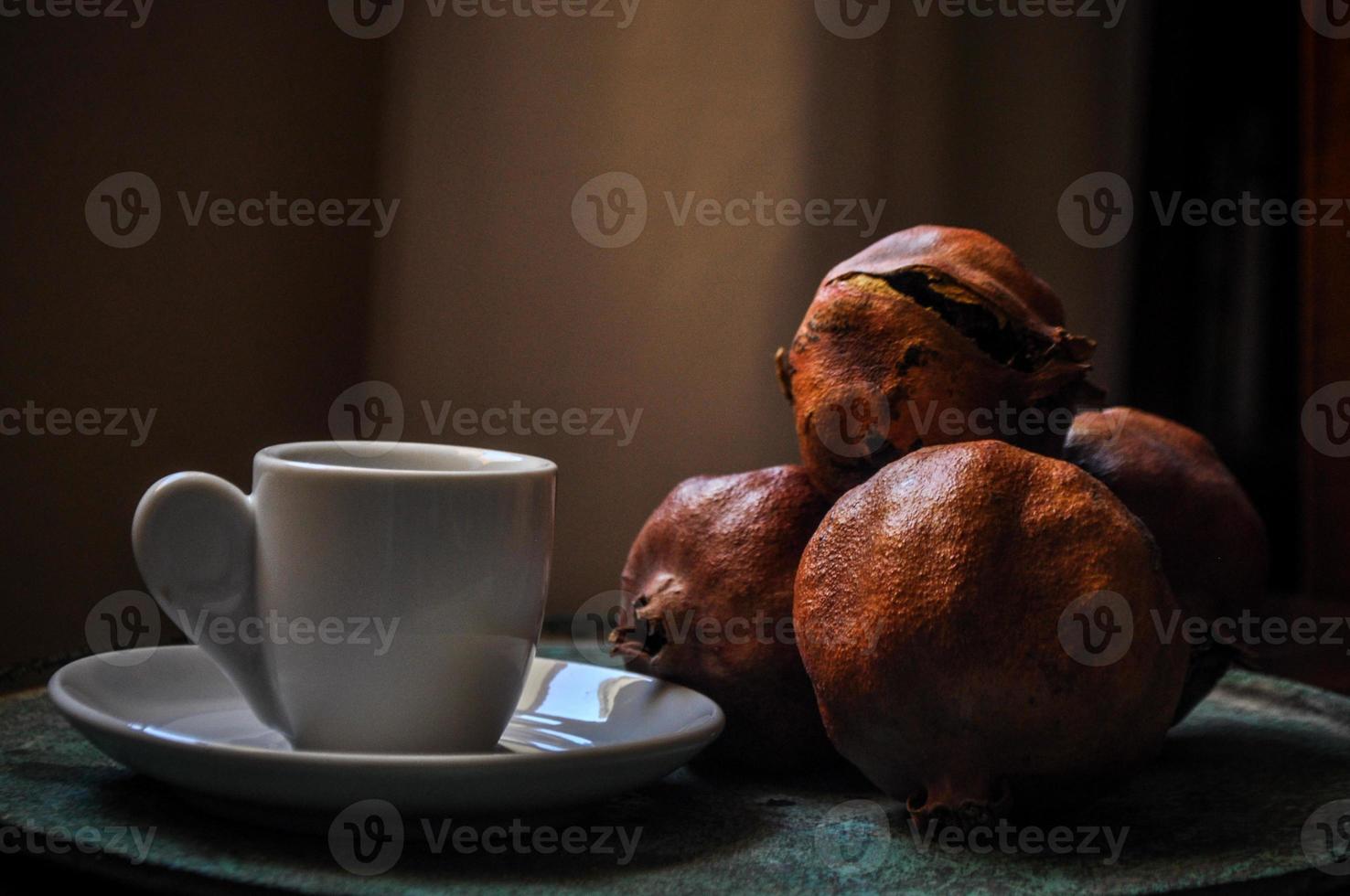 greek coffee and pomegranate in atmospheric light photo