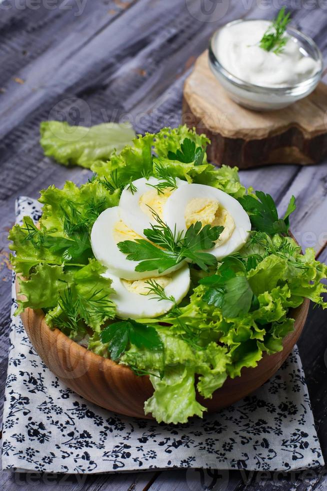 Green vegetarian salad with egg photo